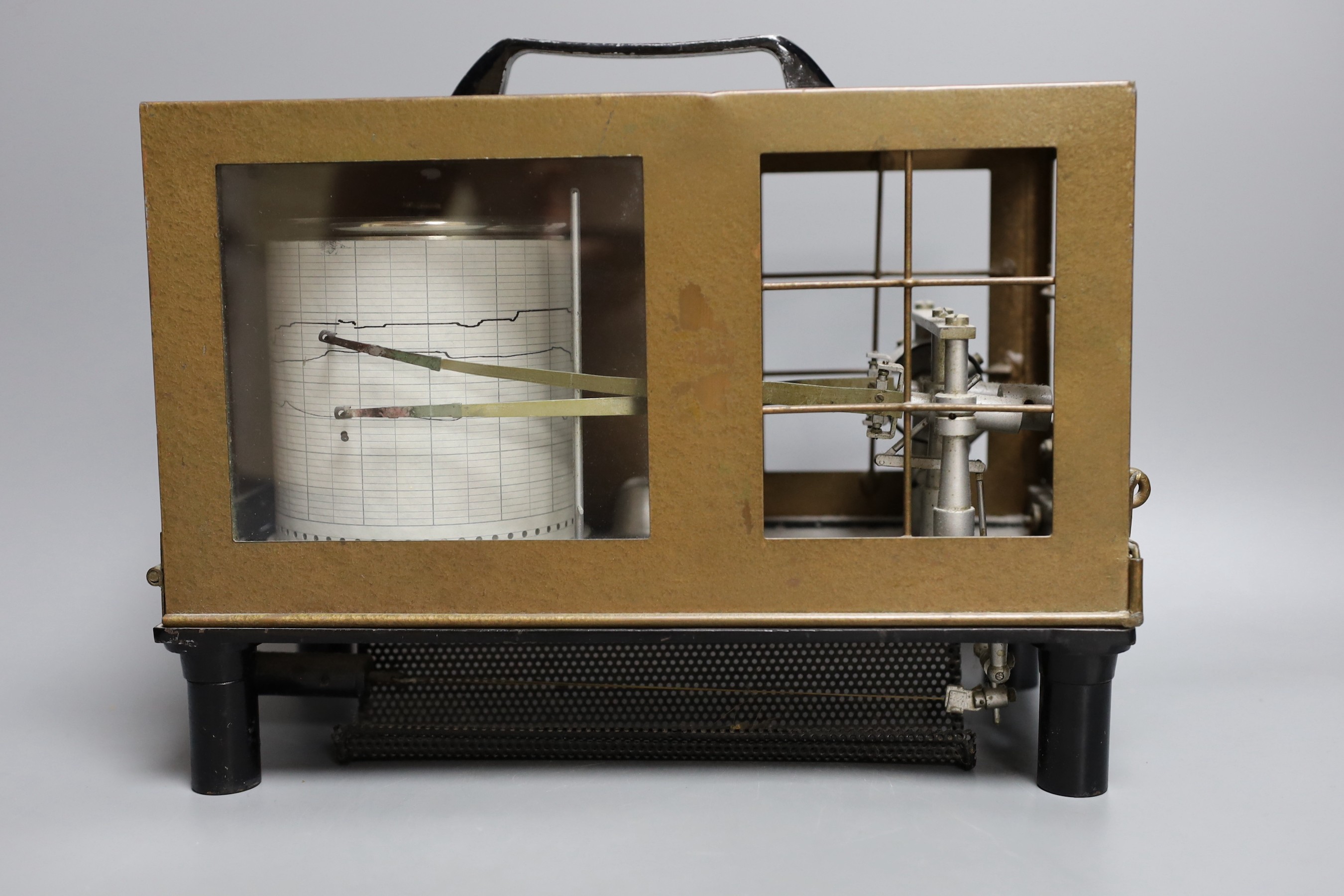 A barograph and three various time pieces including a carriage timepiece, a walnut bracket timepiece and a brass drum timepiece